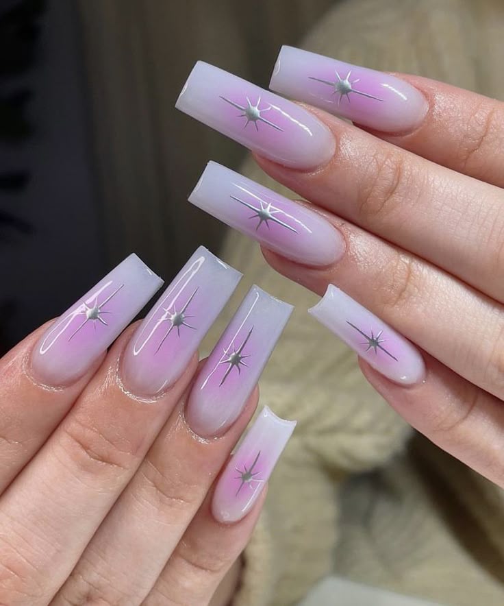 Blush shimmer manicure styled with a pink rose